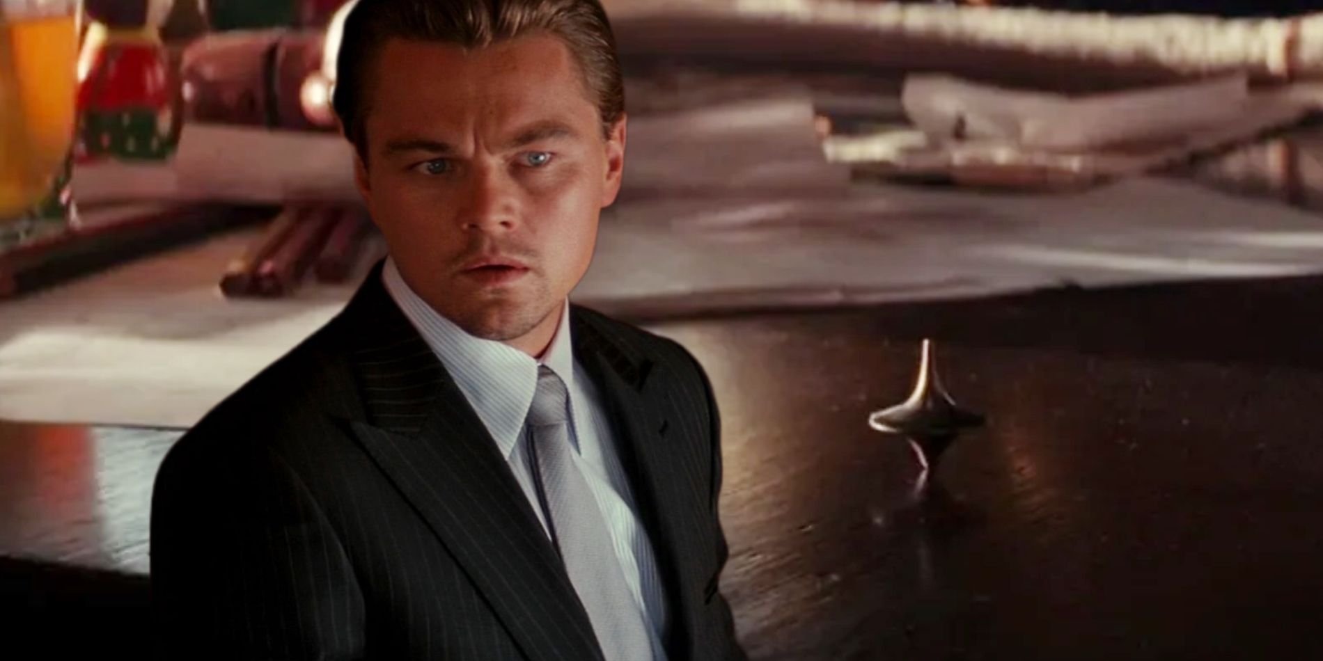 Leonardo-DiCaprio-in-Inception-Next-To-The-Spinning-Top-Totem